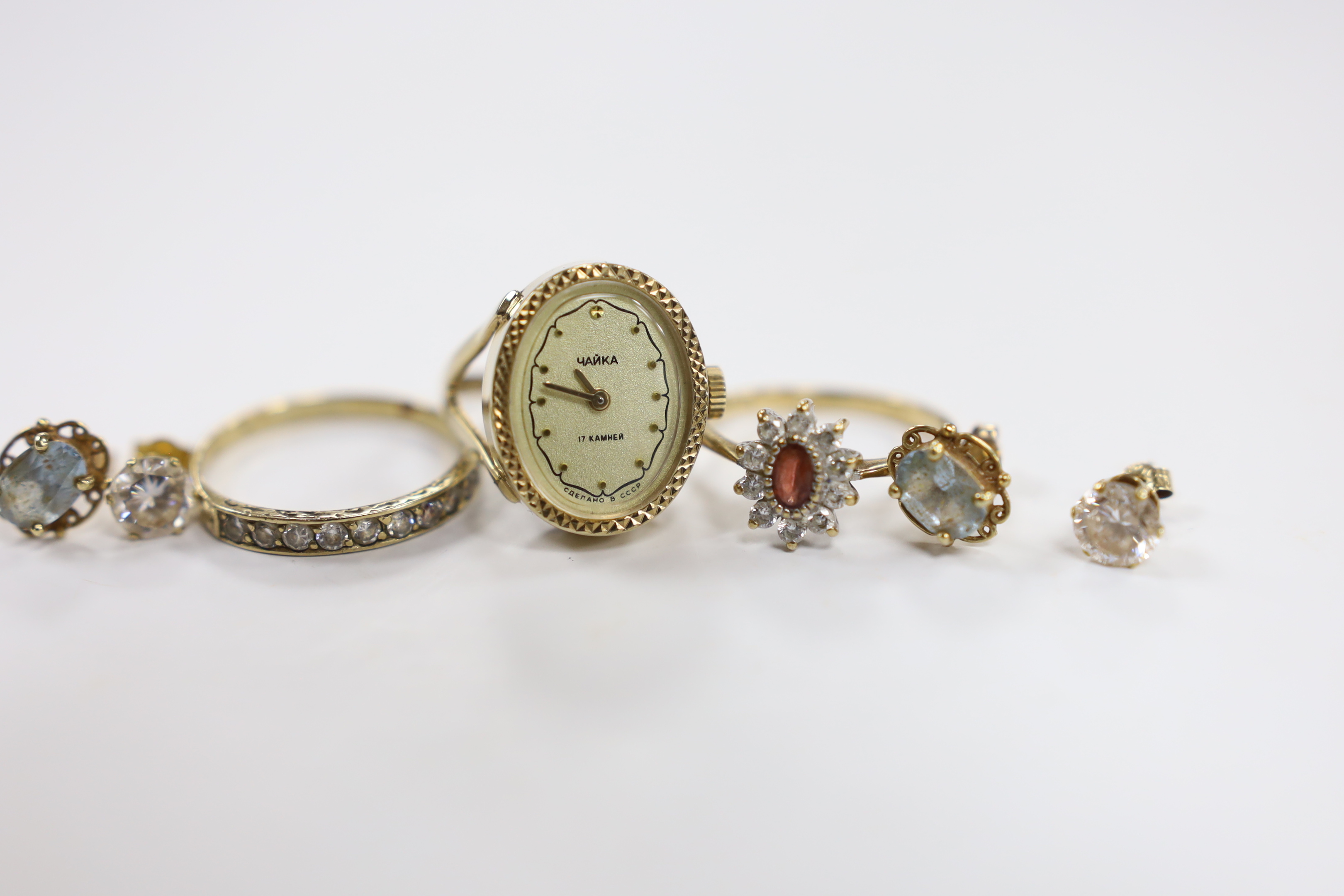 A modern 9ct and CZ set cluster ring, two other rings including watch ring and two pairs of 9ct ear studs.